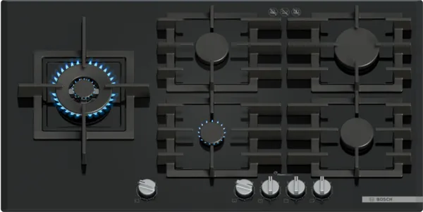 A sleek black gas cooktop with five burners, featuring a central illuminated burner and metallic knobs.