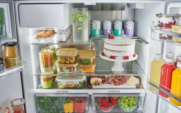 Bosch refrigerator in kitchen shelf pushed back cake front view